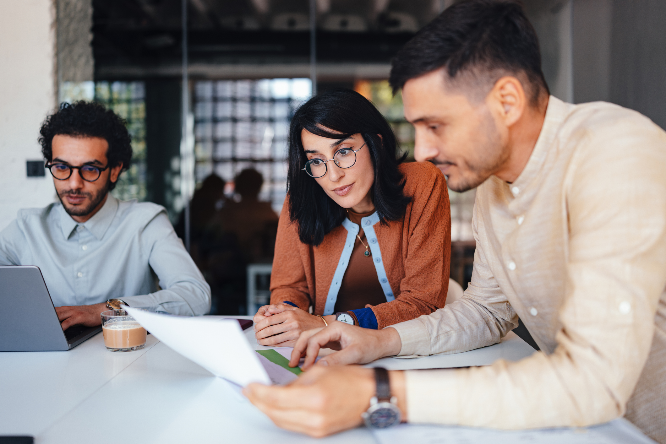 Two people sitting in an office having a conversation