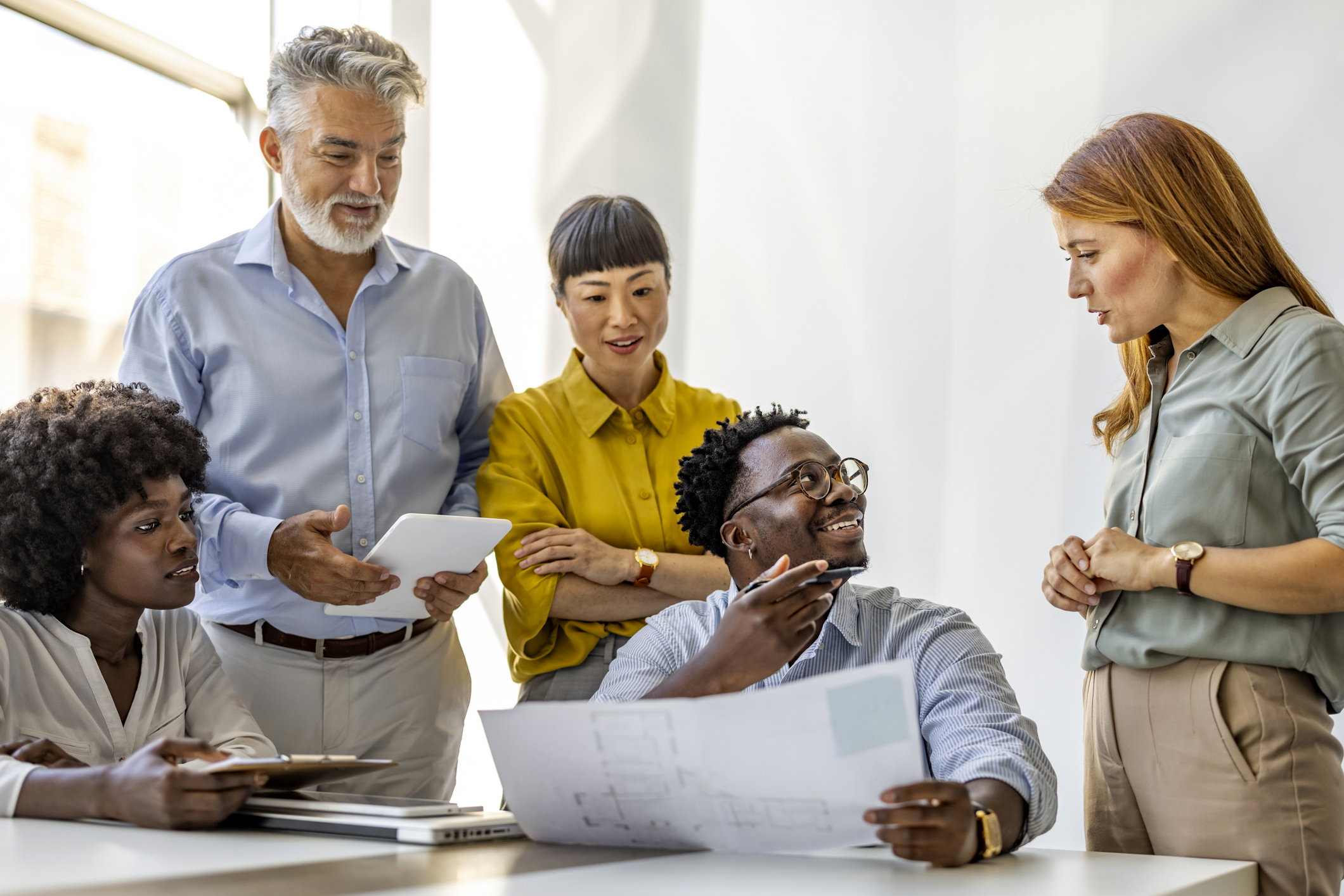 A group of people having a meeting in an office