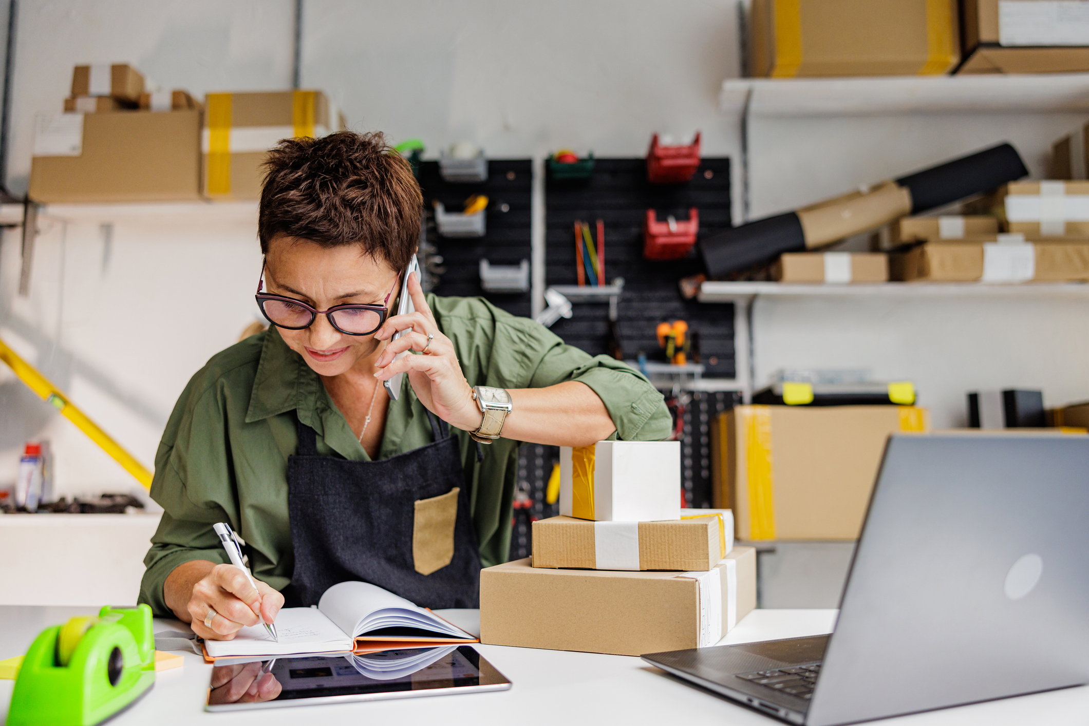 A woman taking an order over the phone